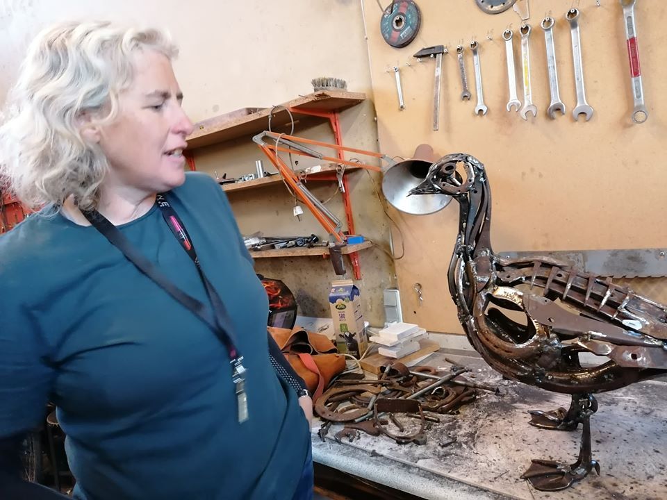 <p>Harriet poses with the barnacle goose created in her workshop during the residency at Højerha</p>