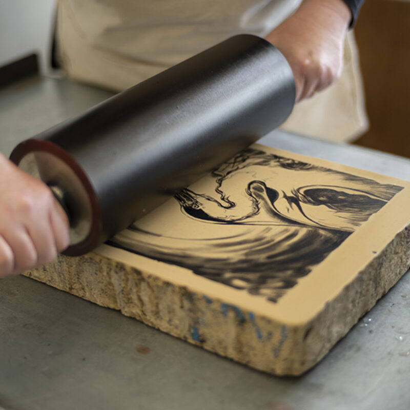  Georgina Coburn inking the lithographic stone   © John Mc Naught, Highland Print Studio